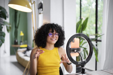 Influencer sitting in front of ring light